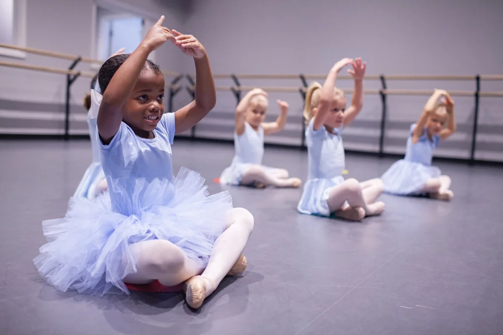 Young dancers enjoying a ballet class together at Bloom